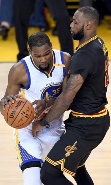 The Latest: Warriors beat Cavs 129-120 to win NBA title